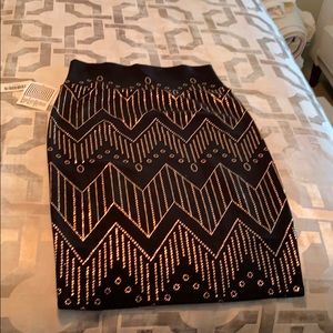 LuLa Roe rose gold and black skirt
